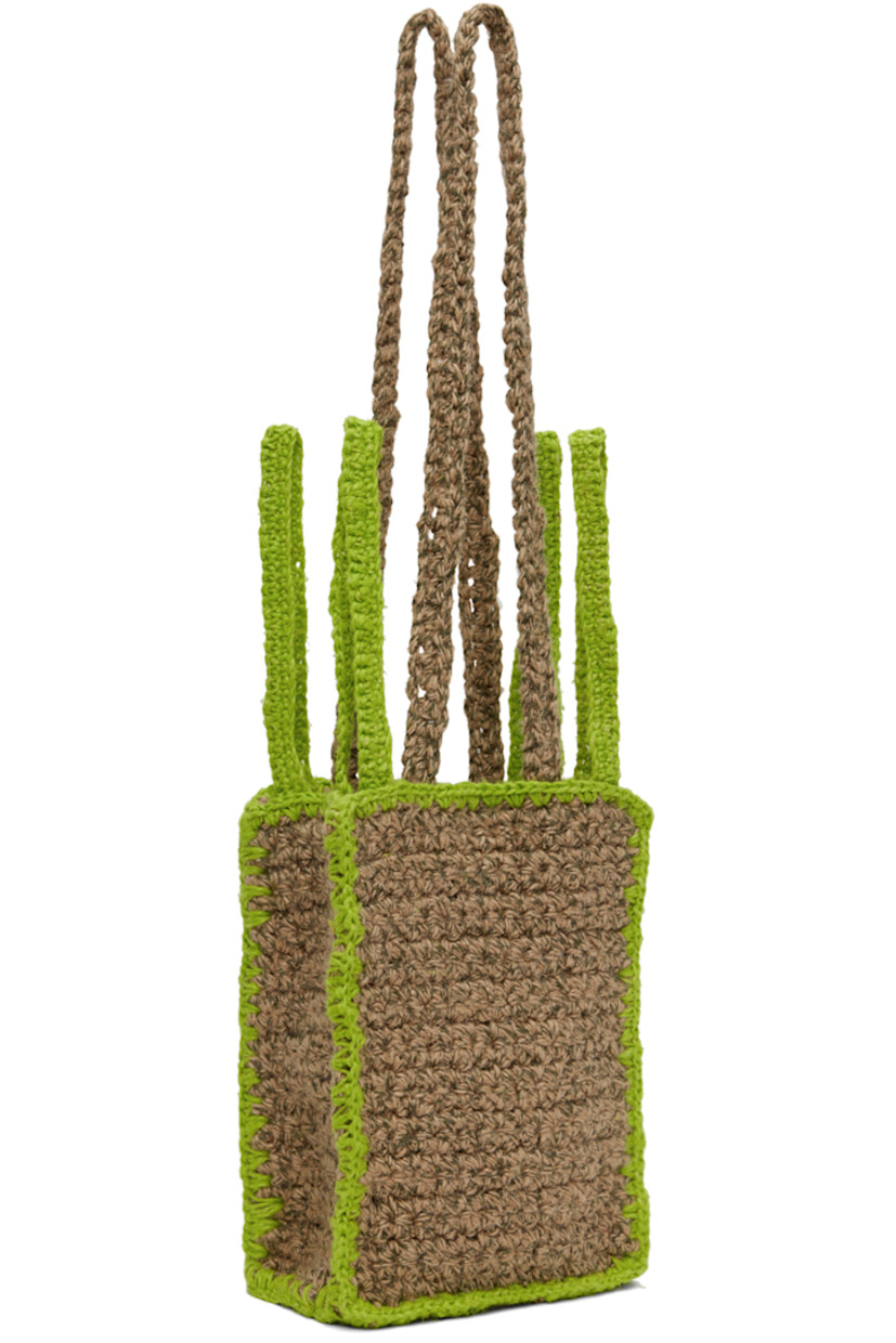 Crocheted jute- and linen-blend shoulder bag in beige and green. Blanket stitching throughout. 

· Fixed shoulder straps
· Four carry handles
· Magnetic press-stud closure
· Patch pocket at interior
· Unlined
· H9 x W6.5 x D3.5 in

Available exclusively at SSENSE.

Supplier color: Sand/Lime