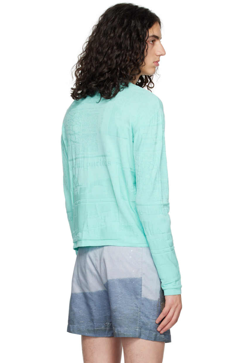 Viscose- and recycled polyester-blend cloqué T-shirt. 

· Logo and graphic pattern throughout
· Rib knit crewneck, hem, and cuffs

Supplier color: Newspaper ciel