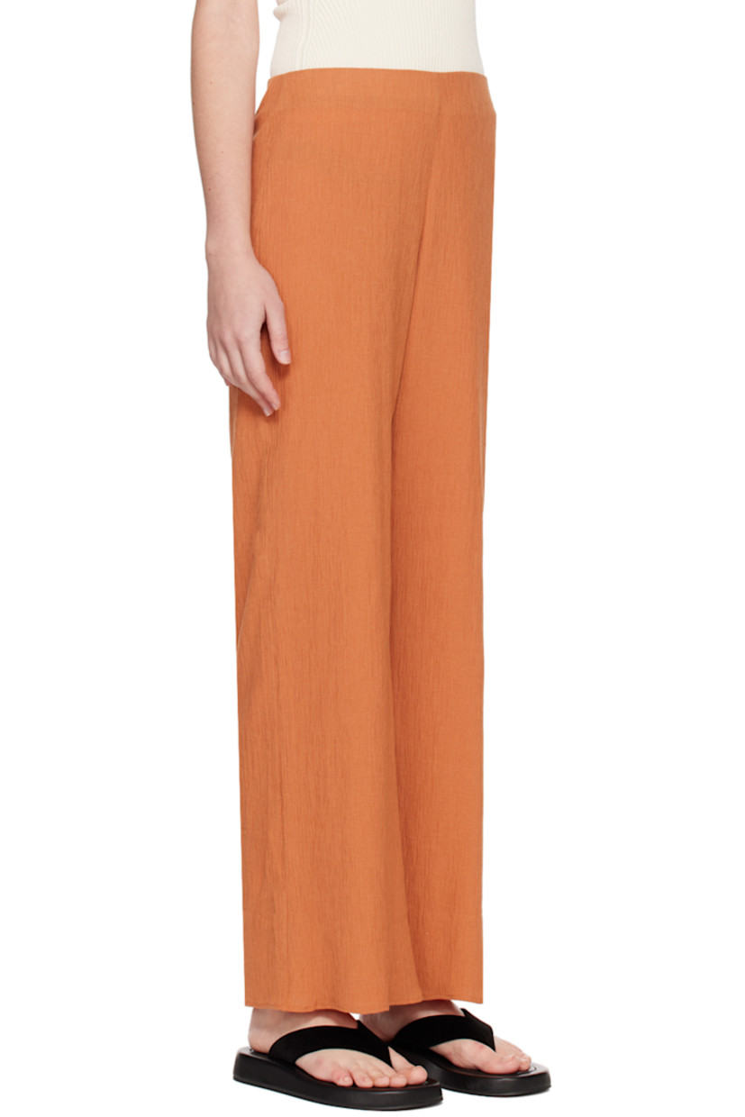 Cotton-blend seersucker trousers. 

· Elasticized waistband 
· Zip closure at outseam
· Full crepe lining

Supplier color: Orange brown