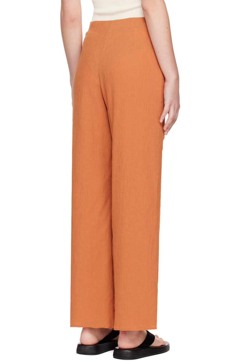 Cotton-blend seersucker trousers. 

· Elasticized waistband 
· Zip closure at outseam
· Full crepe lining

Supplier color: Orange brown