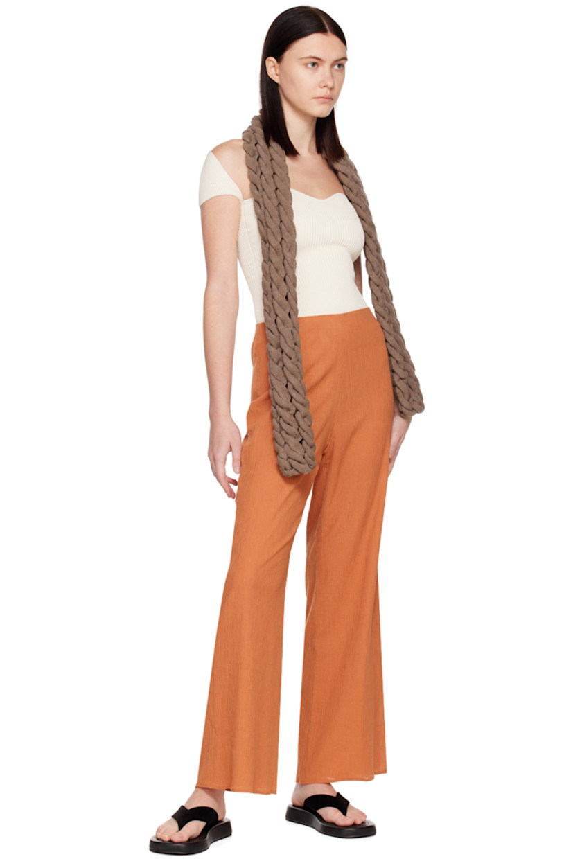 Cotton-blend seersucker trousers. 

· Elasticized waistband 
· Zip closure at outseam
· Full crepe lining

Supplier color: Orange brown