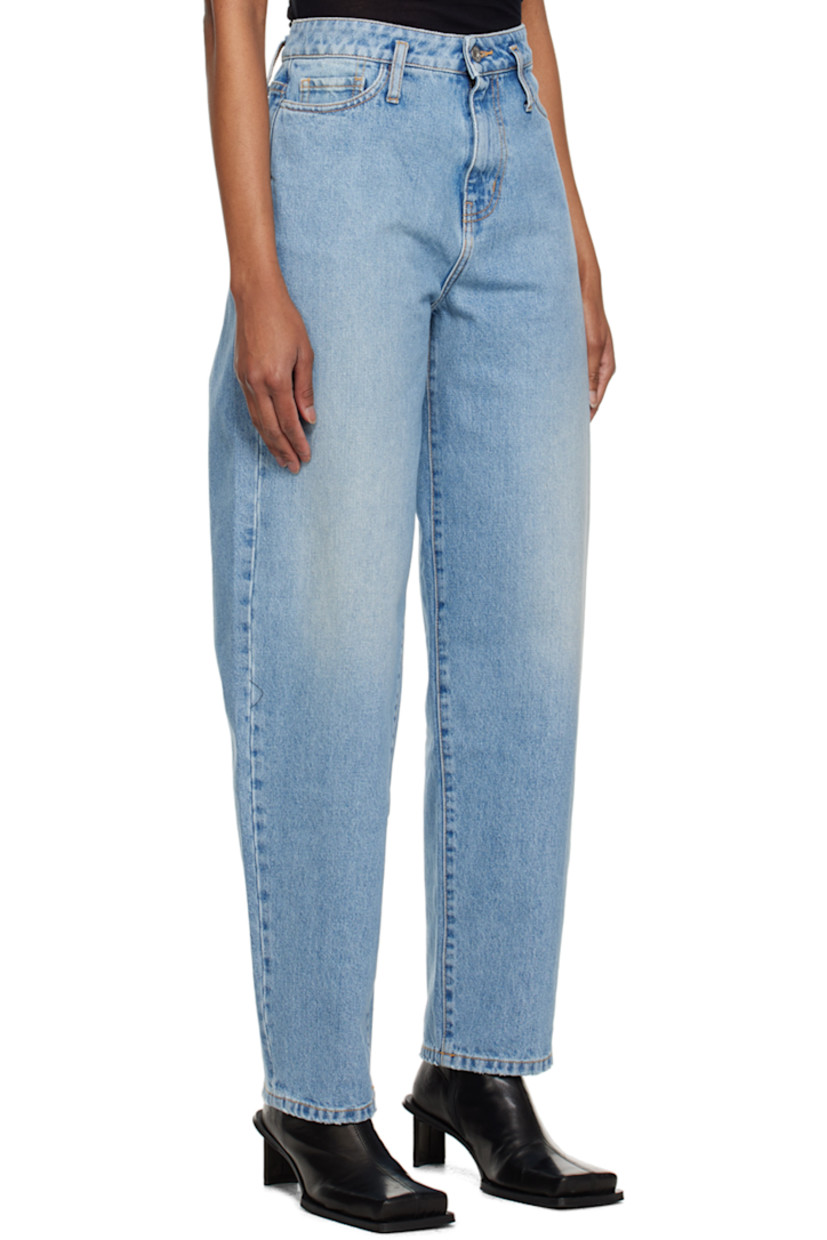 Relaxed-fit non-stretch denim jeans. Fading throughout. 

· Belt loops 
· Five-pocket styling 
· Zip-fly 
· Logo patch at back 
· Contrast stitching in orange 

Supplier color: Dusty blue