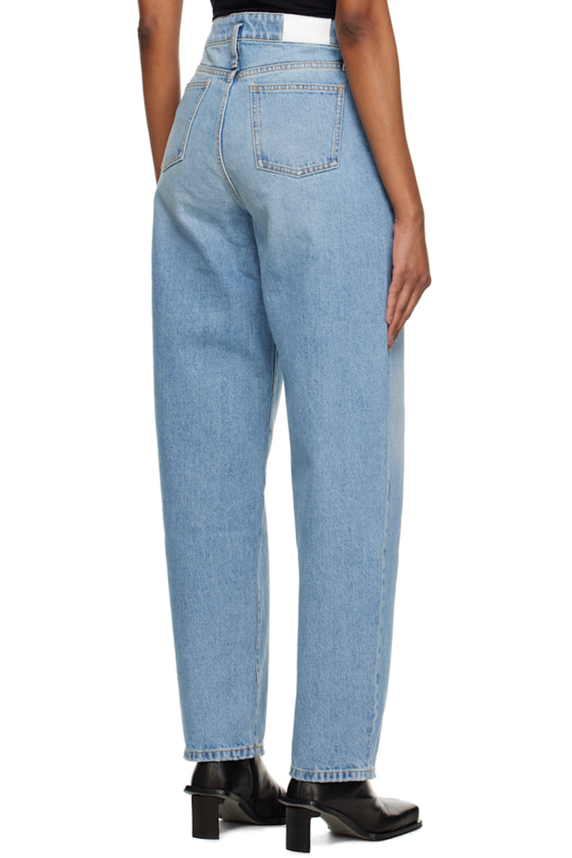 Relaxed-fit non-stretch denim jeans. Fading throughout. 

· Belt loops 
· Five-pocket styling 
· Zip-fly 
· Logo patch at back 
· Contrast stitching in orange 

Supplier color: Dusty blue