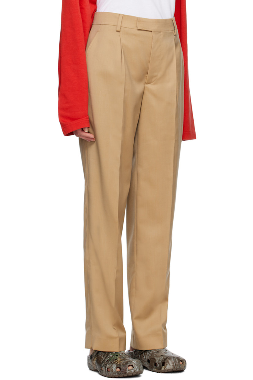 Virgin wool twill trousers.

· Belt loops
· Four-pocket styling
· Zip-fly
· Creased legs
· Unfinished hem
· Zip vent at cuffs
· Piping at outseams

Supplier color: Salted caramel