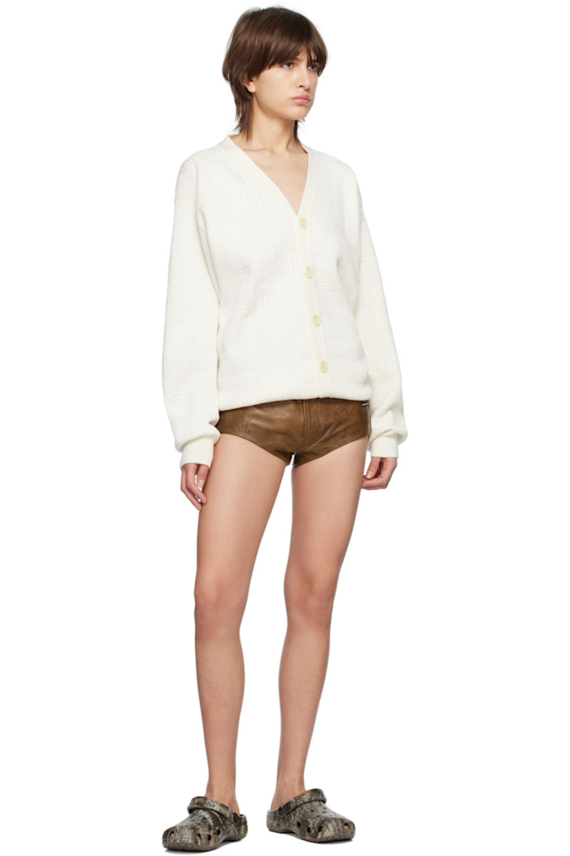 Knit extrafine merino wool cardigan. Logo pattern printed throughout.

· Rib knit Y-neck, hem, and cuffs
· Button closure
· Dropped shoulders

Supplier color: White