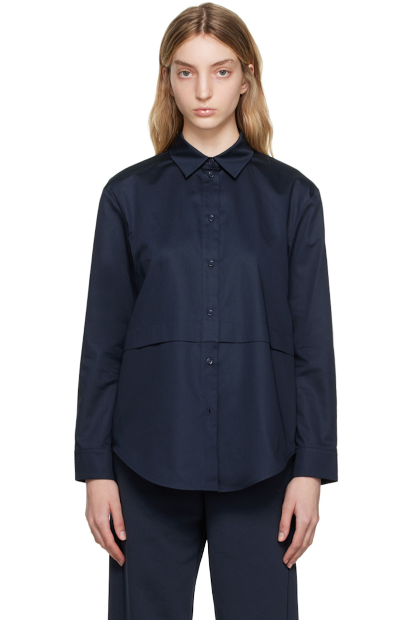 Cotton poplin shirt.

· Paneled construction
· Spread collar
· Button closure
· Shirttail hem
· Single-button barrel cuffs

Supplier color: Midnight blue