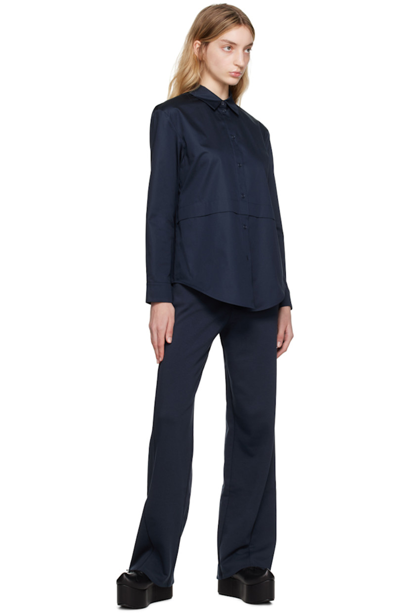 Cotton poplin shirt.

· Paneled construction
· Spread collar
· Button closure
· Shirttail hem
· Single-button barrel cuffs

Supplier color: Midnight blue
