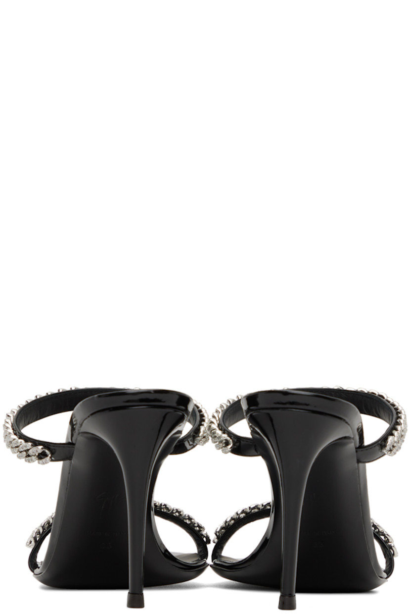 Patent faux-leather slip-on heeled sandals in black. Crystal-cut curb chain detailing at vamp.

· Pointed toe
· Covered stiletto heel with rubber injection 
· Leather outsole
· Heel: H3.5 in

Supplier color: Black