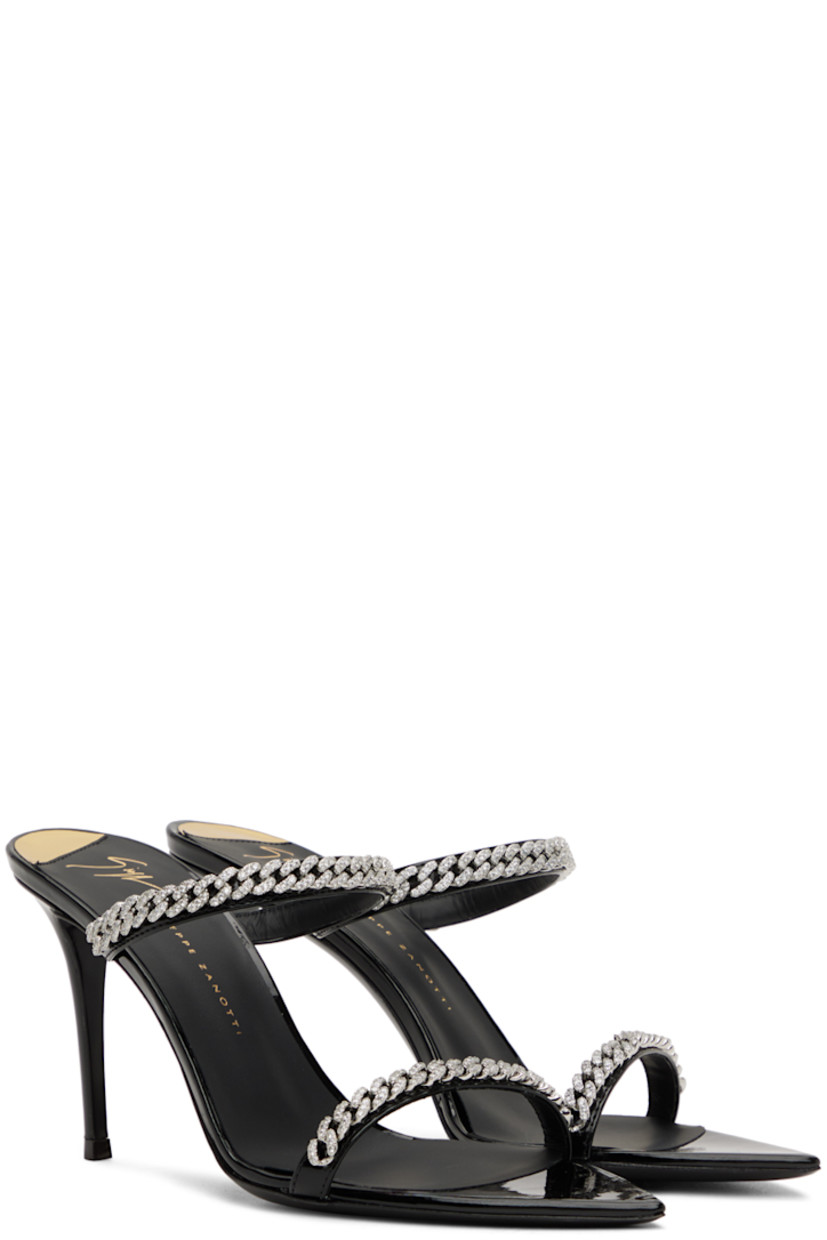 Patent faux-leather slip-on heeled sandals in black. Crystal-cut curb chain detailing at vamp.

· Pointed toe
· Covered stiletto heel with rubber injection 
· Leather outsole
· Heel: H3.5 in

Supplier color: Black