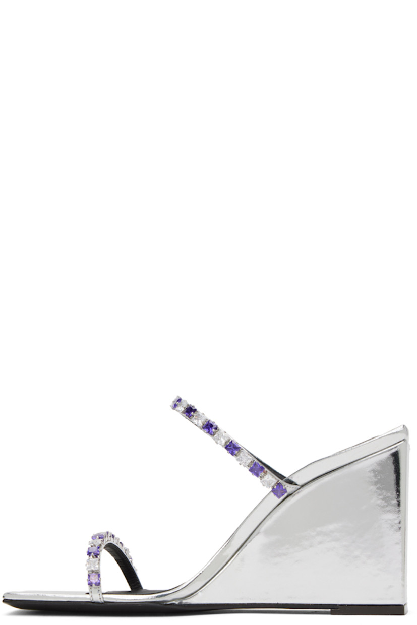 Patent leather slip-on heeled sandals in silver-tone.

· Open square toe
· Straps with crystal-cut accents at vamp
· Logo embossed at cushioned footbed
· Covered block heel with rubber injection
· Leather sole
· Heel: H3.3 in

Supplier color: Silver