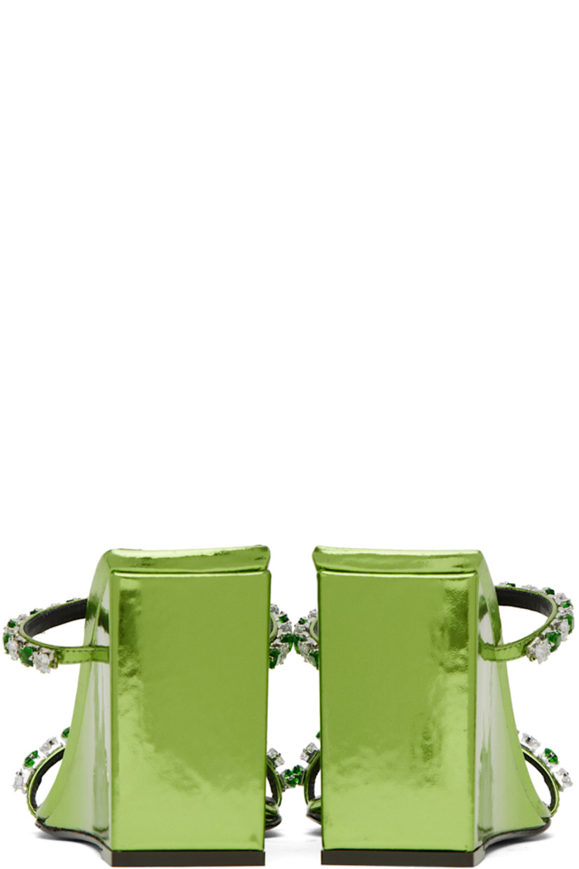 Patent leather slip-on heeled sandals in metallic green.

· Open square toe
· Crystal-cut detailing at vamp
· Logo printed at padded footbed
· Covered wedge heel with rubber injection
· Leather sole
· Heel: H3.5 in

Supplier color: Green lizard