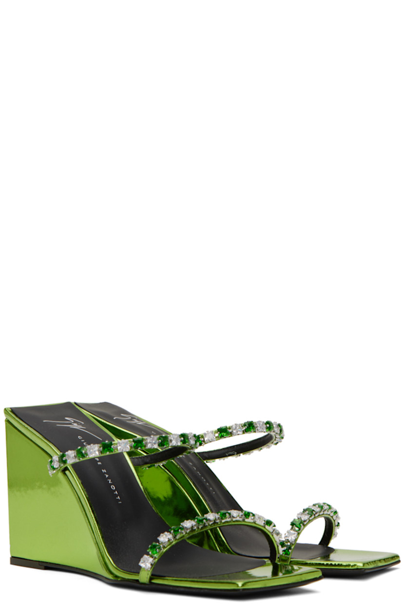 Patent leather slip-on heeled sandals in metallic green.

· Open square toe
· Crystal-cut detailing at vamp
· Logo printed at padded footbed
· Covered wedge heel with rubber injection
· Leather sole
· Heel: H3.5 in

Supplier color: Green lizard