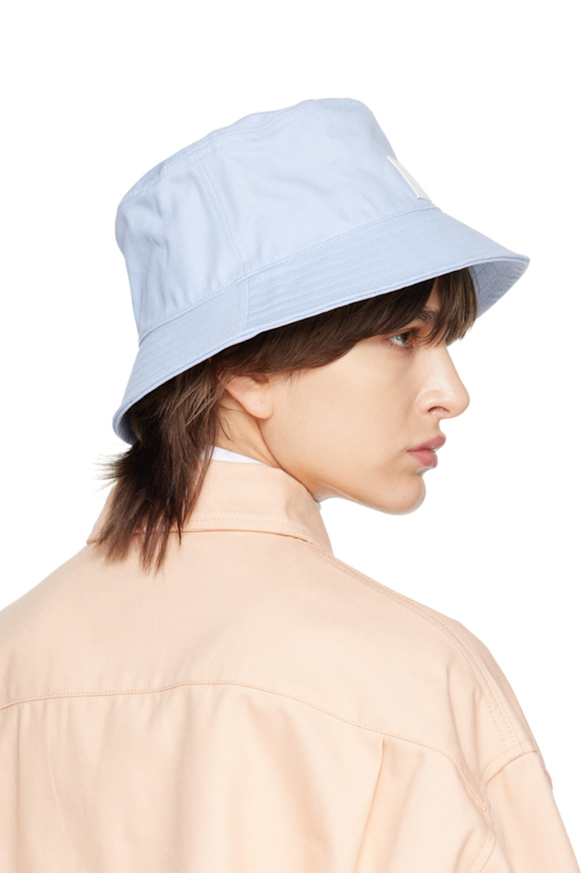 Basket-woven cotton bucket hat in blue.

· Logo-embossed leather patch at face
· Quilted brim
· Grosgrain browband
· Unlined

Supplier color: Light blue