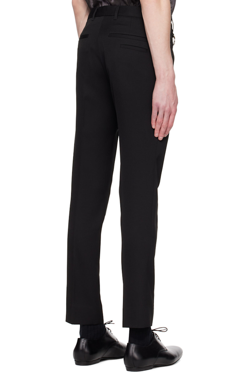 Slim-fit wool gabardine trousers.

· Belt loops 
· Four-pocket styling
· Zip-fly
· Hinged O-ring at front waistband
· Central creases at front and back

Supplier color: Black