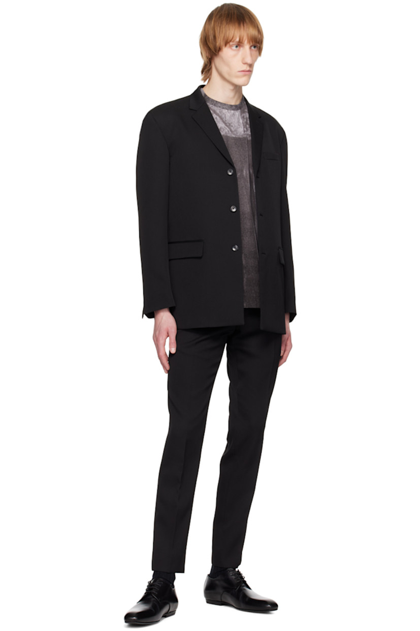 Slim-fit wool gabardine trousers.

· Belt loops 
· Four-pocket styling
· Zip-fly
· Hinged O-ring at front waistband
· Central creases at front and back

Supplier color: Black