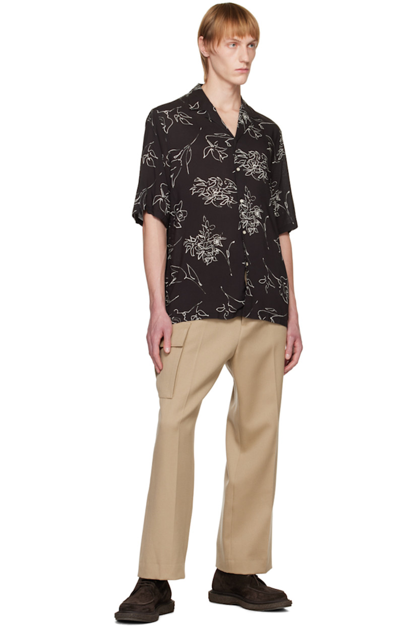 Plain-woven viscose shirt. Graphic pattern printed throughout.

· Open spread collar
· Button closure
· Vented side seams

Supplier color: Black/Ecru