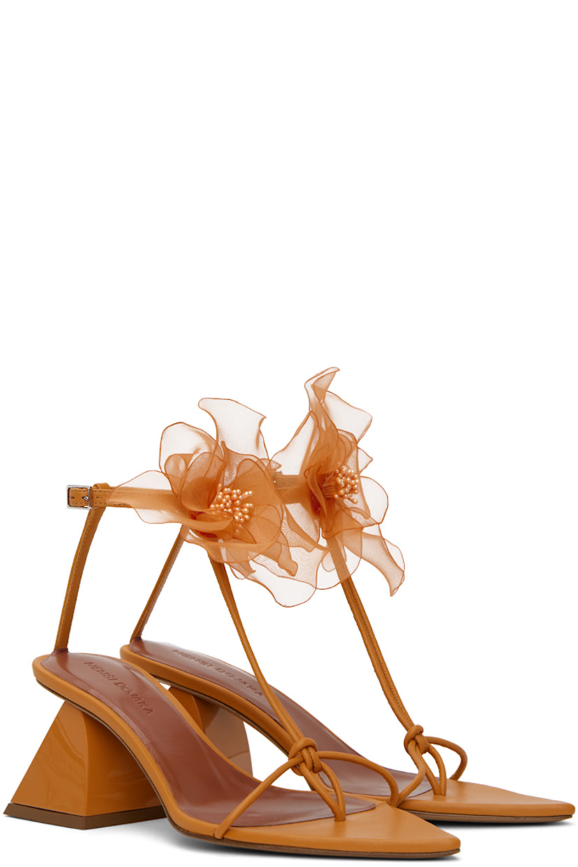 Nappa lambskin heeled sandals in orange. 

· Open pointed toe
· Knotted accent at thong-style strap
· Floral appliqué pin-buckle ankle strap
· Modified block heel with rubber injection
· Leather sole
· Heel: H2.25 in

Supplier color: Orange