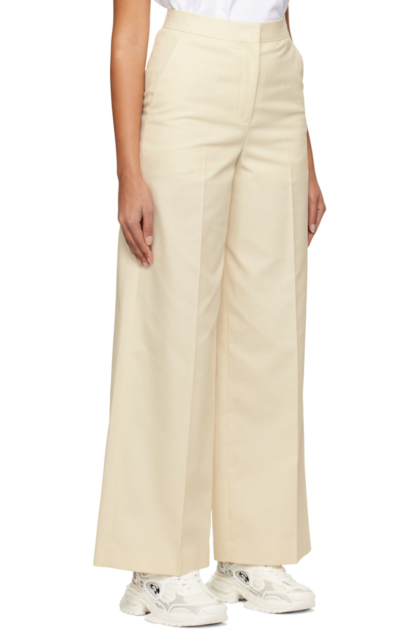 Polyester- and cotton-blend twill trousers.

· Four-pocket styling
· Zip-fly
· Creased legs

Supplier color: Ivory