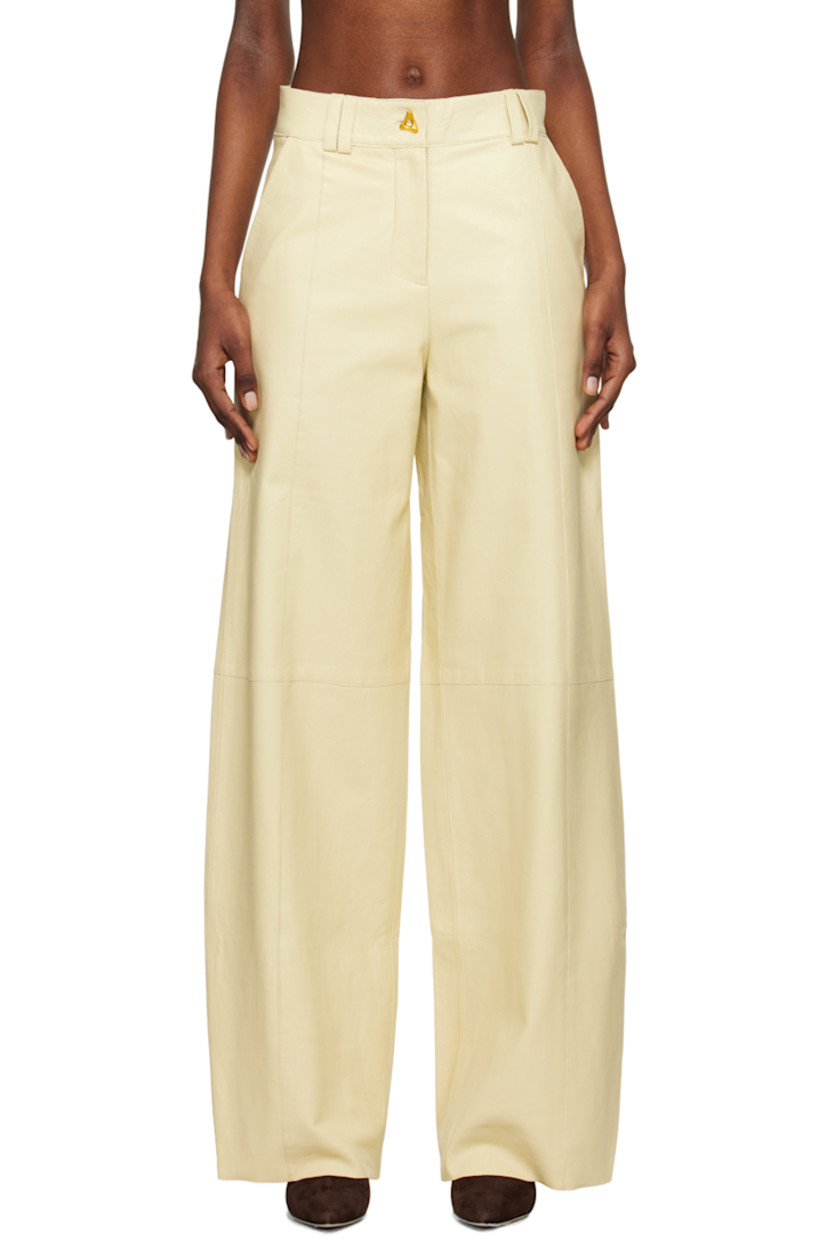Wide-leg grained chrome-free lambskin trousers. Pinched seams throughout. 

· Paneled construction 
· Belt loops
· Two-pocket styling
· Zip-fly
· Full satin lining
· Graphic gold-tone hardware

Supplier color: Oyster