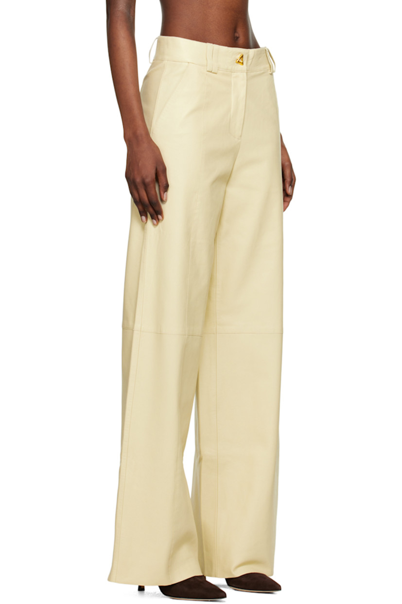 Wide-leg grained chrome-free lambskin trousers. Pinched seams throughout. 

· Paneled construction 
· Belt loops
· Two-pocket styling
· Zip-fly
· Full satin lining
· Graphic gold-tone hardware

Supplier color: Oyster