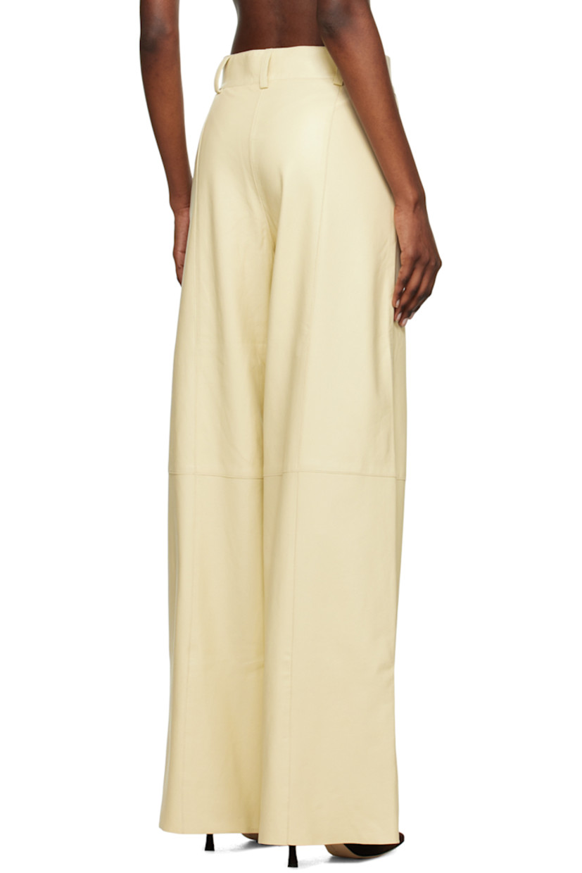Wide-leg grained chrome-free lambskin trousers. Pinched seams throughout. 

· Paneled construction 
· Belt loops
· Two-pocket styling
· Zip-fly
· Full satin lining
· Graphic gold-tone hardware

Supplier color: Oyster
