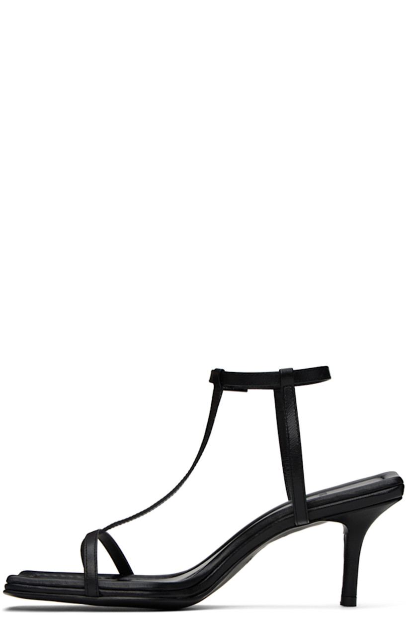 Grained leather heeled sandals in black.

· Open square toe
· Thong-style strap at vamp
· Pin-buckle ankle strap
· Logo embossed at padded footbed
· Covered kitten heel with rubber injection
· Leather sole
· Heel: H2.5 in

Supplier color: Black