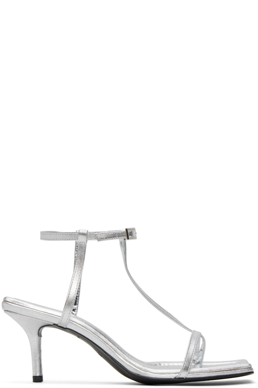 Grained leather heeled sandals in silver-tone.

· Open square toe
· Thong-style strap at vamp
· Pin-buckle ankle strap
· Logo embossed at padded footbed
· Covered kitten heel with rubber injection
· Leather sole
· Heel: H2.5 in

Supplier color: Grey
