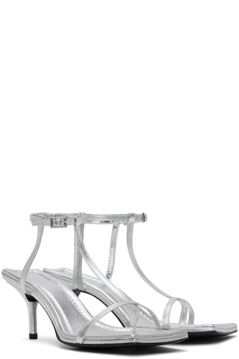 Grained leather heeled sandals in silver-tone.

· Open square toe
· Thong-style strap at vamp
· Pin-buckle ankle strap
· Logo embossed at padded footbed
· Covered kitten heel with rubber injection
· Leather sole
· Heel: H2.5 in

Supplier color: Grey
