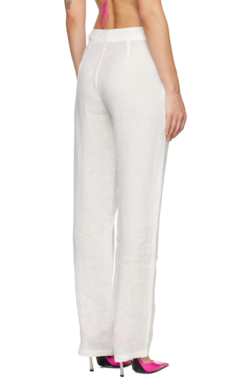 Wide-leg plain-woven cotton trousers. 

· Two-pocket styling 
· Zip-fly 
· Adjustable button tabs at back waistband 

Supplier color: White