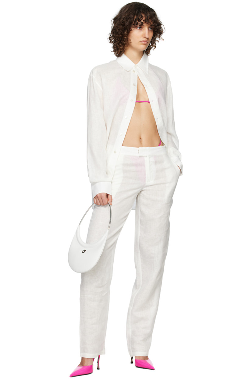 Wide-leg plain-woven cotton trousers. 

· Two-pocket styling 
· Zip-fly 
· Adjustable button tabs at back waistband 

Supplier color: White
