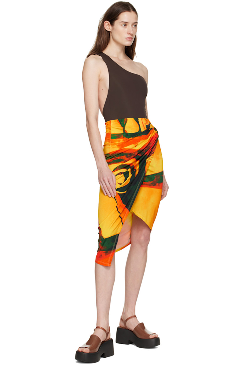Stretch viscose jersey skirt. Pattern printed throughout.  

· Wrap construction
· O-ring and cutout at side seam
· Asymmetric hem
· Unlined

Supplier color: Checkmate