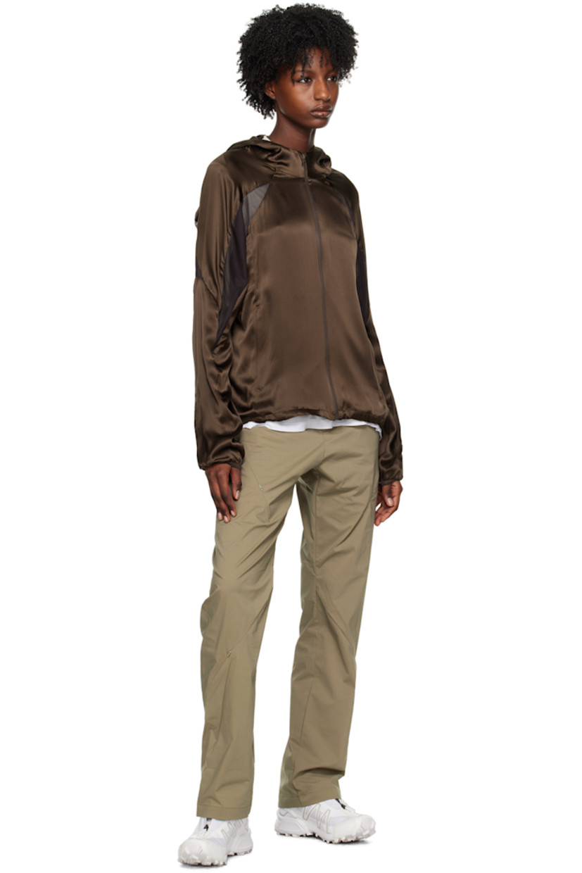 Paneled silk satin and polyester mesh jacket.

· Stand collar
· Zip closure
· Zip pockets
· Concealed bungee-style drawstring at hem
· Raglan sleeves
· Elasticized cuffs

Supplier color: Brown