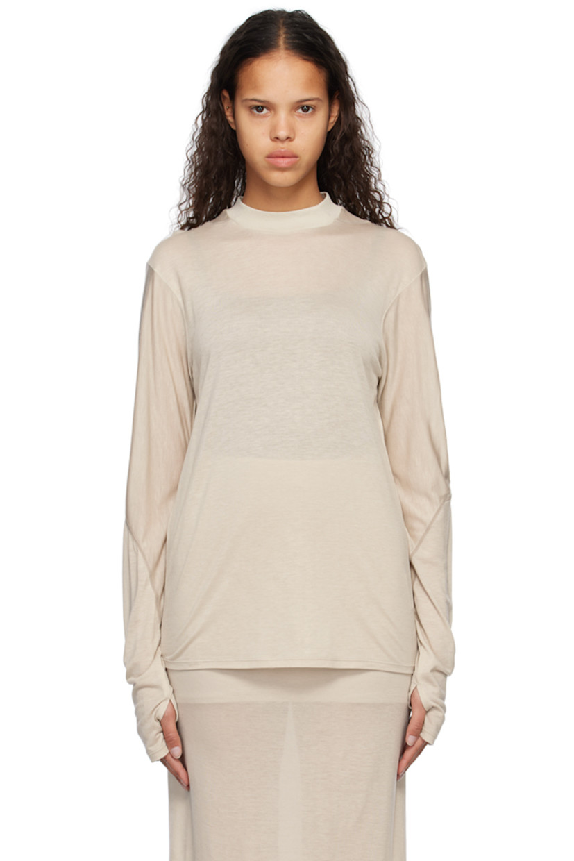 Lightweight semi-sheer lyocell jersey T-shirt.

· Paneled construction
· Rib knit mock neck
· Dropped shoulders
· Thumbhole at cuffs
· Topstitching in gray throughout

Supplier color: Warm grey