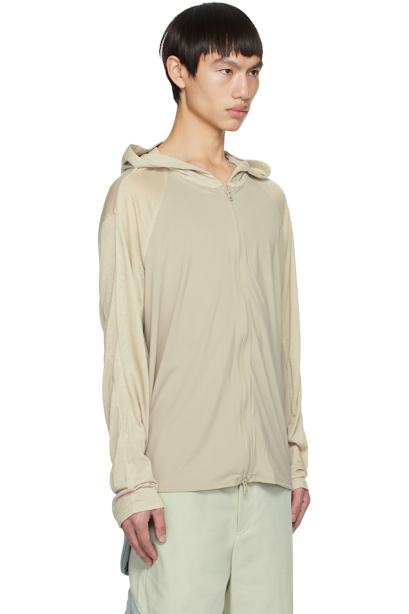 Crinkled nylon taffeta jacket. Water-resistant, lightweight, and packable.

· Zip closure extends from hood to back
· Bungee-style drawstring at hood
· Zip closure
· Zip pockets
· Concealed bungee-style drawstring at hem
· Thumbhole at elasticized cuffs
· Unlined

Supplier color: Gray green