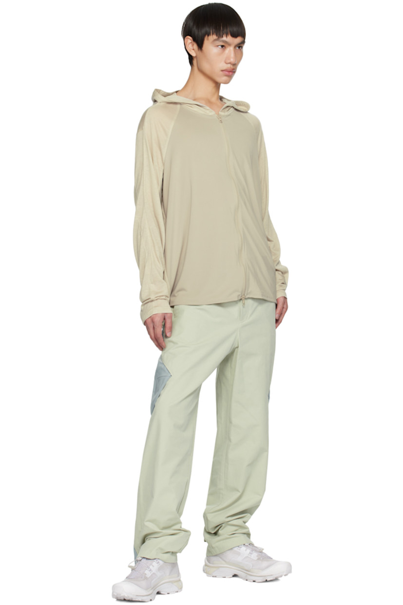 Crinkled nylon taffeta jacket. Water-resistant, lightweight, and packable.

· Zip closure extends from hood to back
· Bungee-style drawstring at hood
· Zip closure
· Zip pockets
· Concealed bungee-style drawstring at hem
· Thumbhole at elasticized cuffs
· Unlined

Supplier color: Gray green