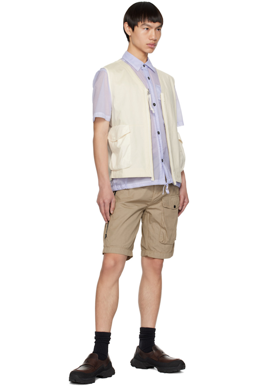 Garment-dyed heavyweight cotton jersey vest.

· V-neck
· Zip closure
· Flap pockets
· Acetate lens at side seam
· Unlined

Supplier color: Gauze white