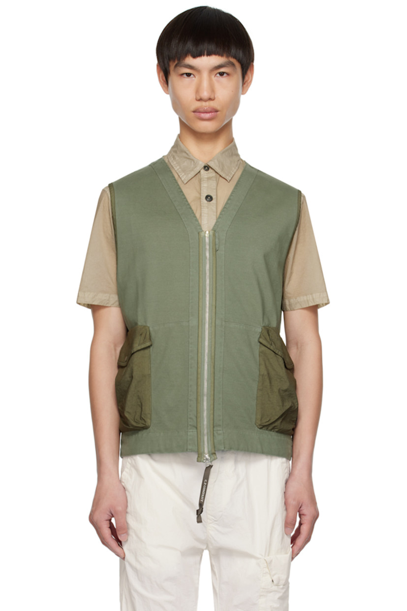 Garment-dyed heavyweight cotton jersey vest.

· V-neck
· Zip closure
· Flap pockets
· Acetate lens at side seam
· Unlined

Supplier color: Bronze green