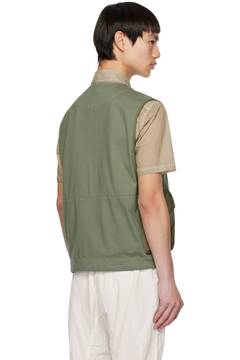 Garment-dyed heavyweight cotton jersey vest.

· V-neck
· Zip closure
· Flap pockets
· Acetate lens at side seam
· Unlined

Supplier color: Bronze green