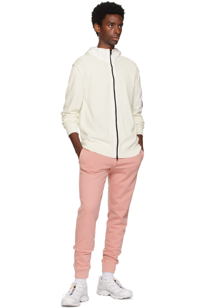 Resist-dyed cotton fleece sweatpants.

· Drawstring at elasticized waistband
· Three-pocket styling
· Mock-fly
· Logo embroidered at front
· Rib knit cuffs

Supplier color: Pale mauve