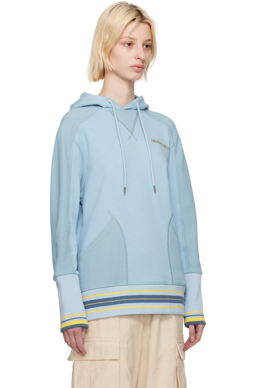 French terry and waffle knit cotton hoodie.

· Drawstring at hood
· Logo printed at chest
· Patch pockets
· Stripes at rib knit hem and cuffs
· Thumbhole at cuffs

Featuring artwork by Kione Granadison.

Supplier color: Powder blue