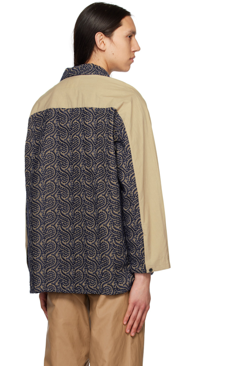 Cotton poplin shirt. Graphic pattern embroidered throughout. 

· Paneled construction 
· Open spread collar 
· Button closure 
· Welt pockets
· Tennis-tail hem 
· Single-button barrel cuffs 

Supplier color: Beige/Navy