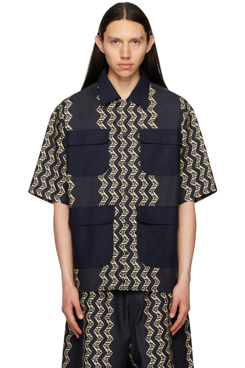 Cotton canvas shirt. Graphic pattern printed throughout. 

�· Spread collar 
· Button closure 
· Flap pockets 
· Tennis-tail hem 
· Locker loop at back yoke 

Supplier color: Indigo/Ecru