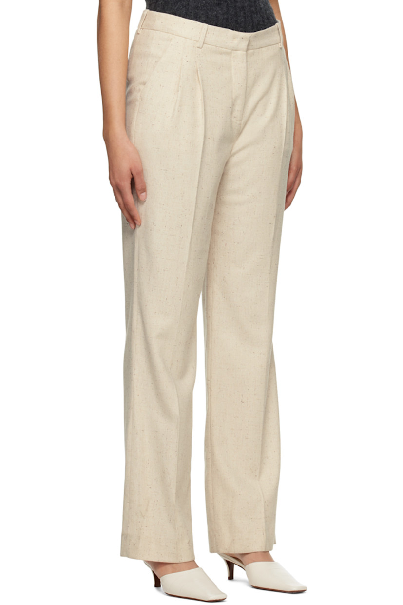 Straight-leg stretch viscose and wool-blend twill trousers.

· Belt loops
· Three-pocket styling
· Zip-fly
· Pleats at front waistband
· Central crease at front and back legs
· Partial plain-woven lining 

Supplier color: Linen