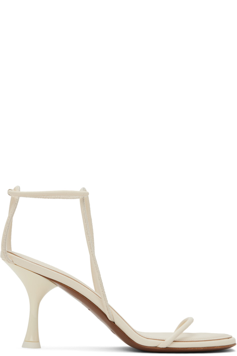 Grained nappa leather heeled sandals in white. 

· Rolled straps at vamp and ankle 
· Gold-tone logo stamp at padded footbed 
· Stiletto heel with rubber injection
· Leather sole
· Heel: H3.5 in 

Supplier color: Cream