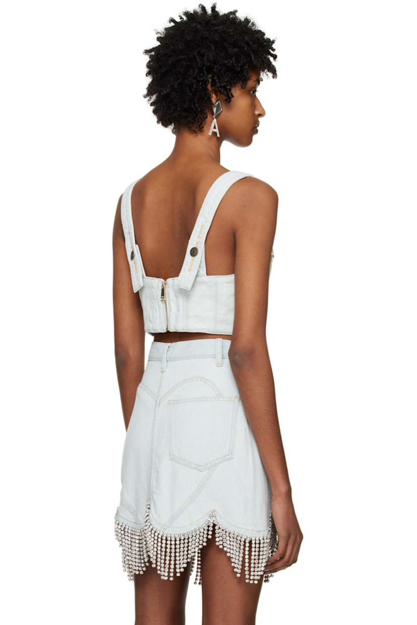 Non-stretch cotton- and recycled cotton-blend denim camisole. Fading throughout. 

· Sweetheart neck 
· Crystal-cut detailing and bow accents at front 
· Adjustable shoulder straps 
· Zip closure at back 
· Full cotton twill lining 
· Logo-engraved antiqued gold-tone hardware 
· Contrast stitching in gold 

Supplier color: Pale blue