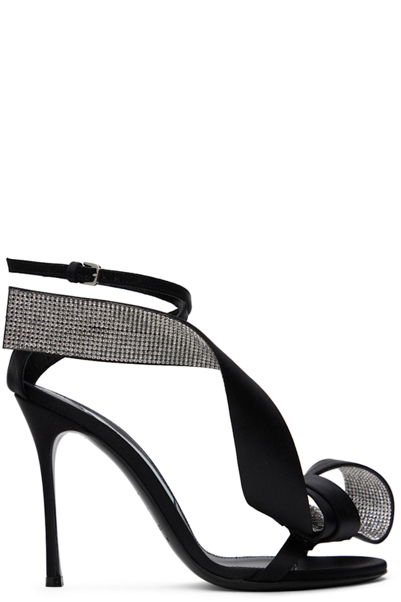 Satin heeled sandals in black. Crystal-cut accents and bow accent at open toe.

· Pin-buckle ankle strap 
· Logo patch at leather footbed
· Covered stiletto heel with rubber injection 
· Leather sole
· Heel: H3.75 in

Part of the Area x Sergio Rossi collaboration.

Supplier color: Black