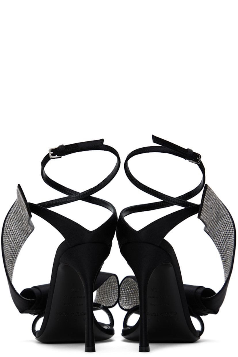 Satin heeled sandals in black. Crystal-cut accents and bow accent at open toe.

· Pin-buckle ankle strap 
· Logo patch at leather footbed
· Covered stiletto heel with rubber injection 
· Leather sole
· Heel: H3.75 in

Part of the Area x Sergio Rossi collaboration.

Supplier color: Black