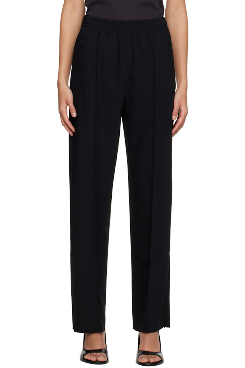 Polyester crepe trousers. 

· Concealed drawstring at elasticized waistband
· Three-pocket styling
· Pinched seams at front 
· Zip vent at cuffs 
· Piping at outseams 

Supplier color: Black