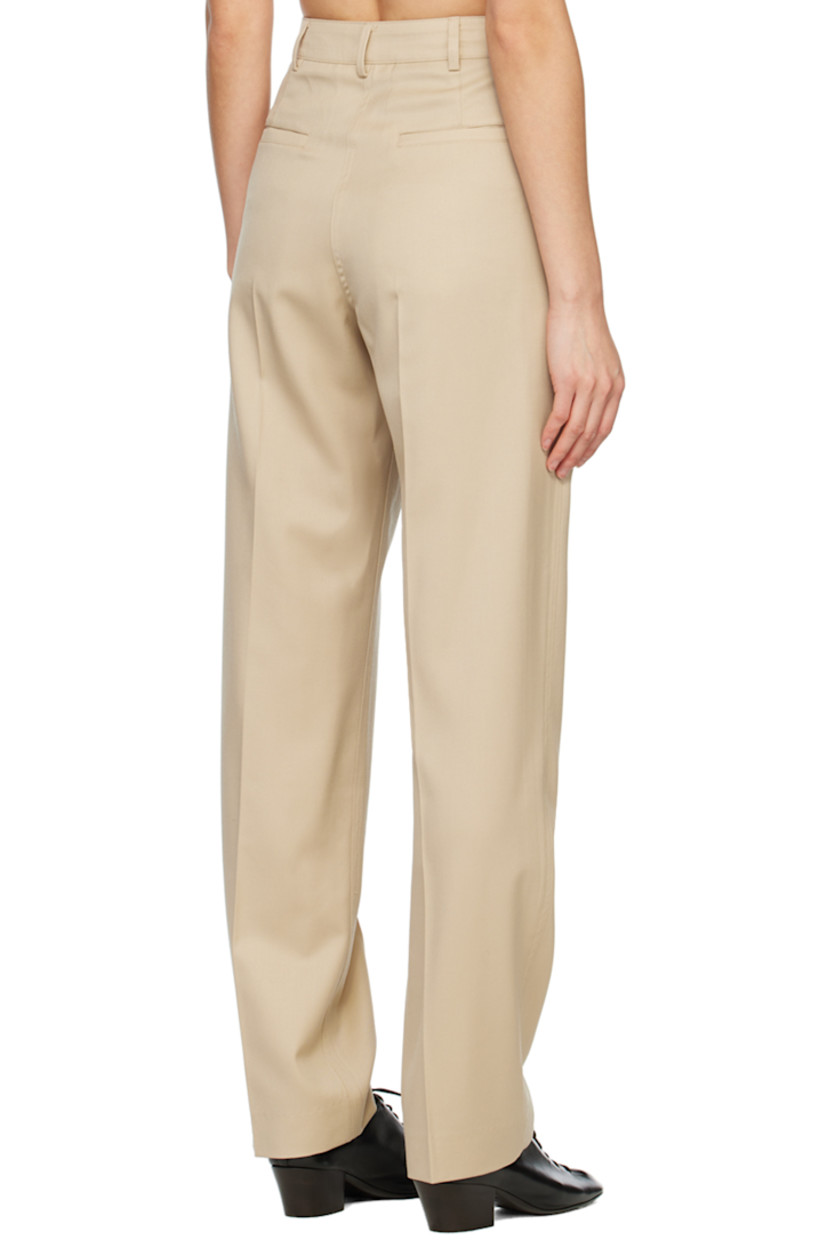 Relaxed-fit straight-leg wool twill trousers. 

· Belt loops
· Four-pocket styling
· Zip-fly
· Creased legs

Supplier color: Beige