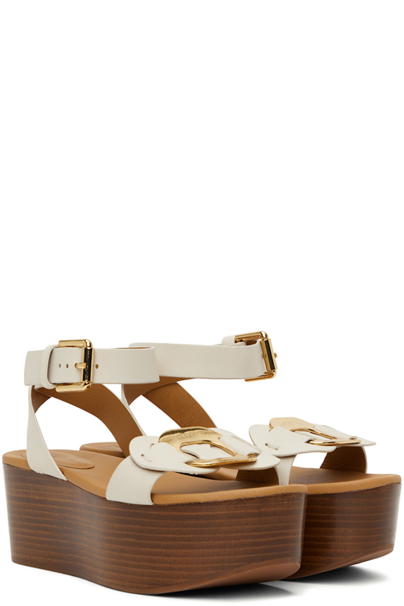 Grained calfskin sandals in white. 

· Open round toe
· Logo-engraved hardware at vamp
· Pin-buckle fastening at ankle strap
· Logo-embossed leather footbed
· Wooden platform midsole and wedge heel
· Rubber outsole 
· Platform: H2.5"

Supplier color: Natural